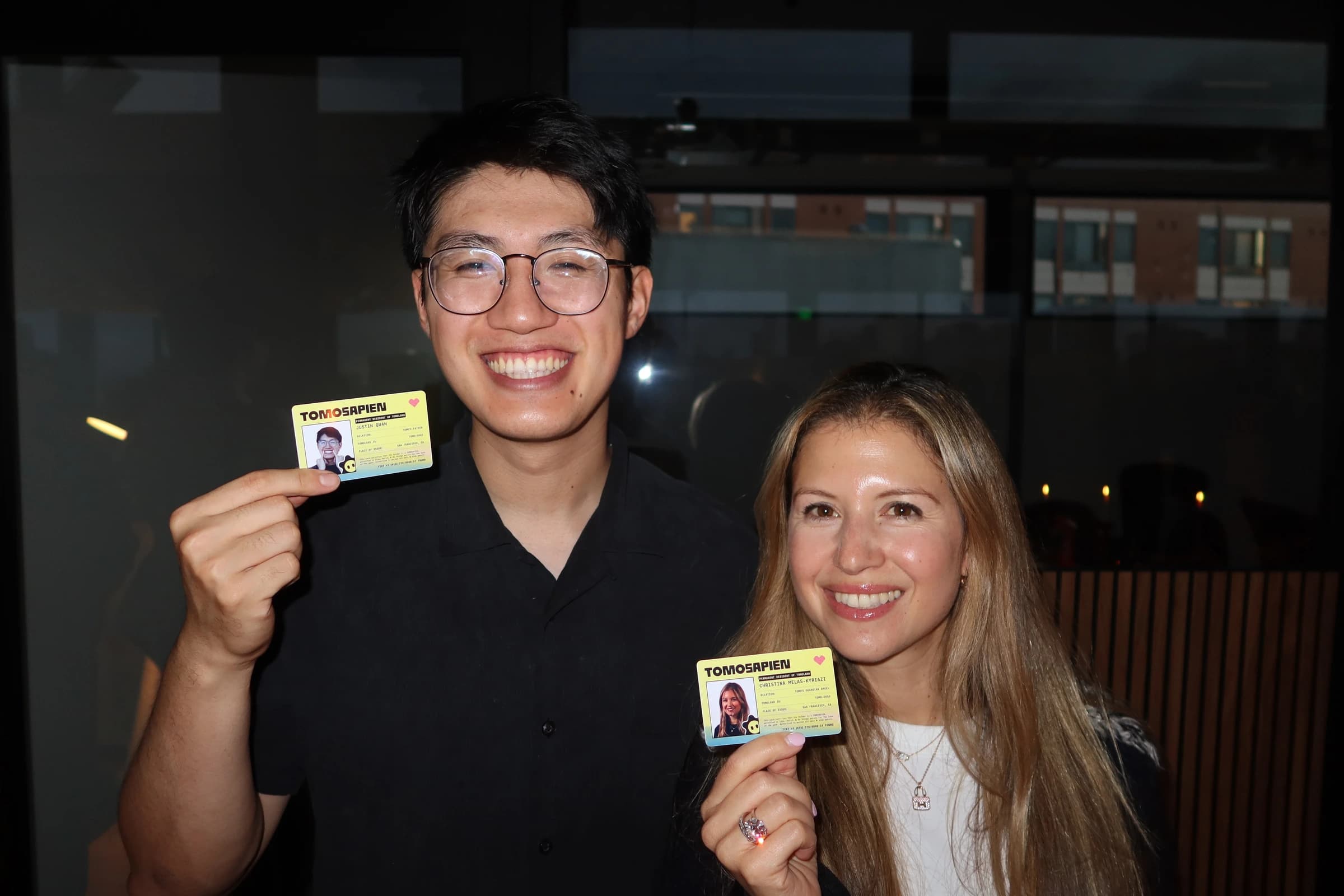 Team members holding Tomosapien cards